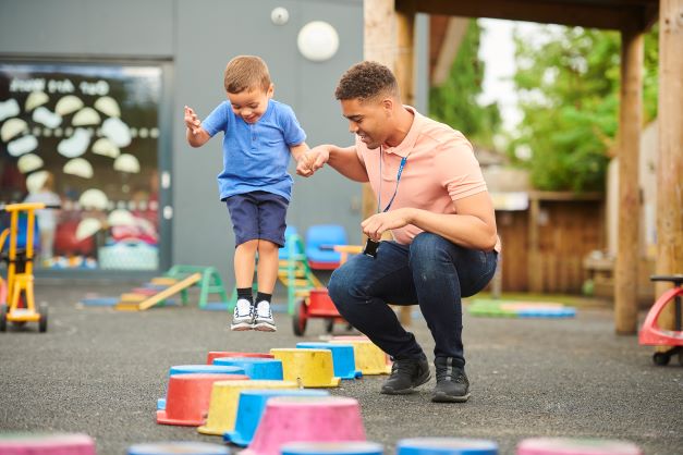 Teacher with young student